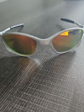 Oakley Silver Frame Sunglasses with Orange-Green Mirrored Lenses